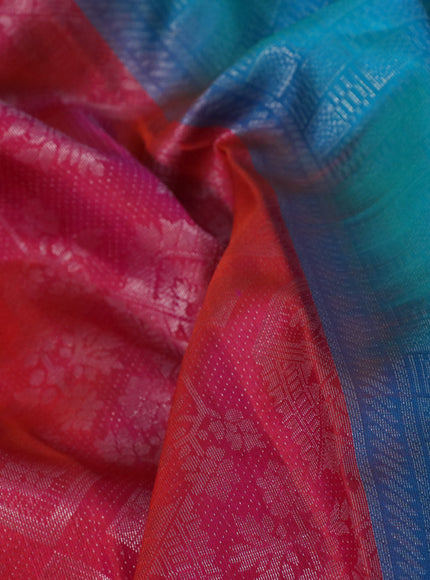 Pure soft silk saree dual shade of pinkish orange and dual shade of teal green with allover silver zari woven brocade weaves and rich silver zari woven border