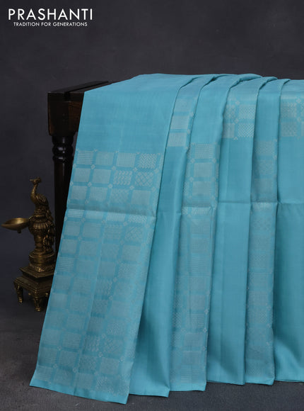 Pure soft silk saree teal blue shade with silver zari woven geometric buttas in borderless style