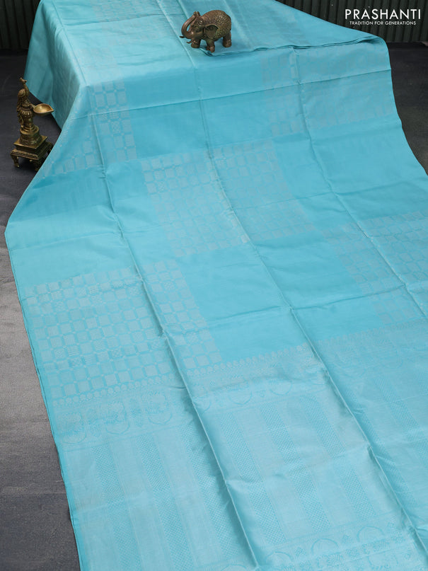 Pure soft silk saree teal blue shade with silver zari woven geometric buttas in borderless style