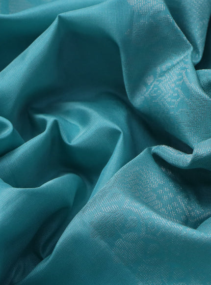 Pure soft silk saree teal blue shade with silver zari woven geometric buttas in borderless style