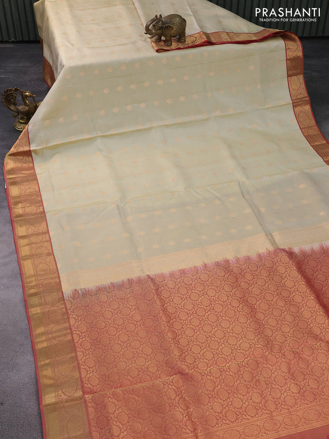 Pure soft silk saree cream and dual shade of maroon with allover zari woven buttas and zari woven border