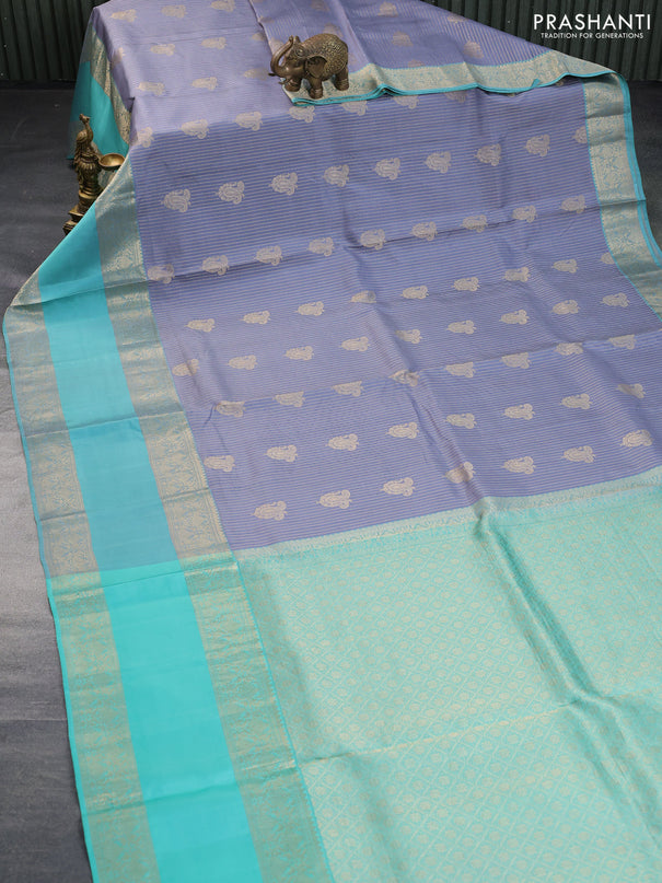 Pure kanchipuram silk saree grey and teal blue with allover zari weaves & buttas and long rettapet zari woven border - aari work blouse