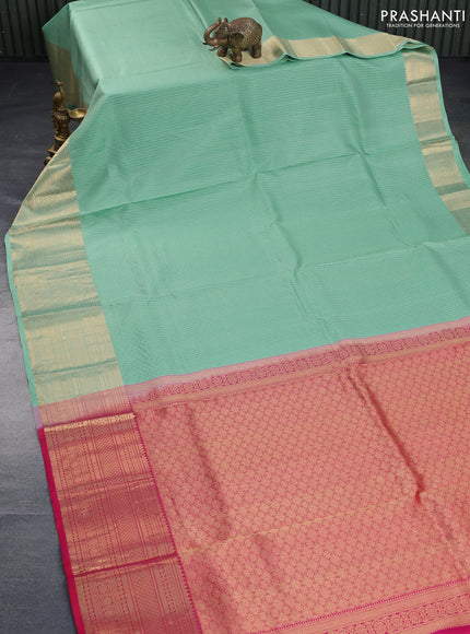 Pure kanchipuram silk saree pastel green and pink with allover zari stripe pattern and rich zari woven border - aari work blouse