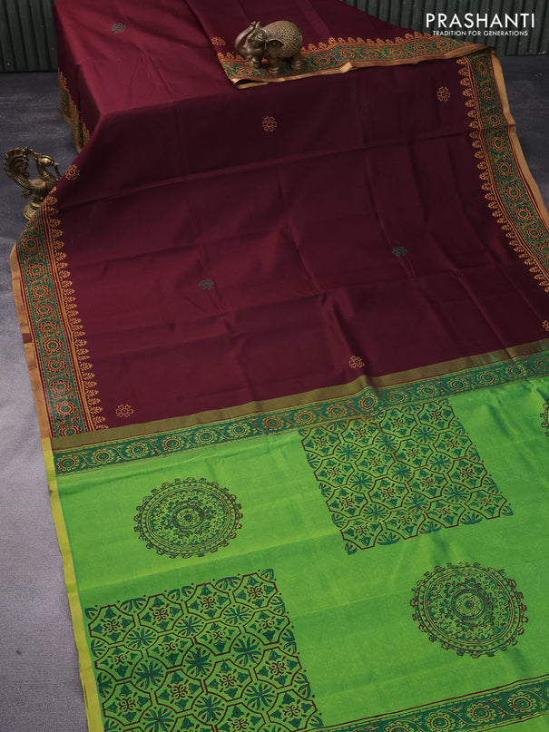 Silk cotton block printed saree deep maroon and light green with floral butta prints and zari woven piping border