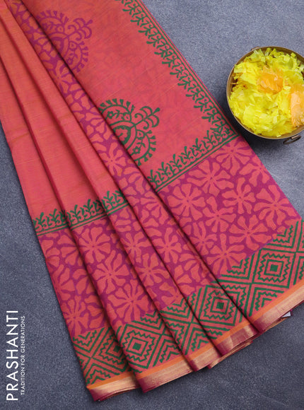 Silk cotton block printed saree dual shade of pinkish orange with floral butta prints and zari woven piping border