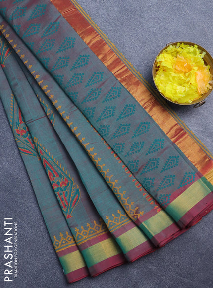 Silk cotton block printed saree dual shade of teal greenish maroon with butta prints and zari woven border