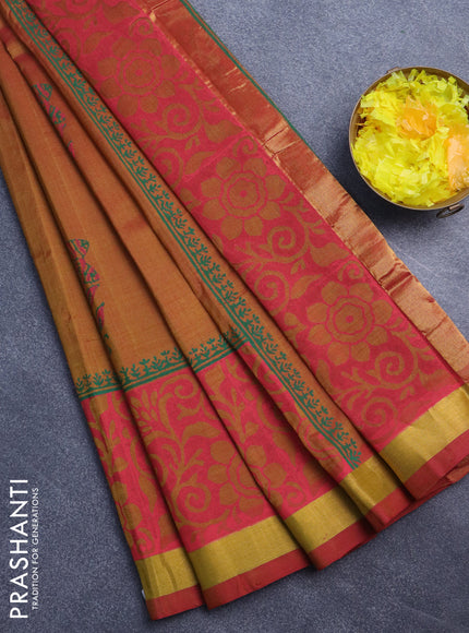 Silk cotton block printed saree dual shade of dark mustard with floral butta prints and zari woven border