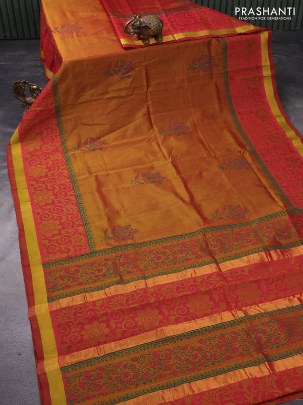 Silk cotton block printed saree dual shade of dark mustard with floral butta prints and zari woven border