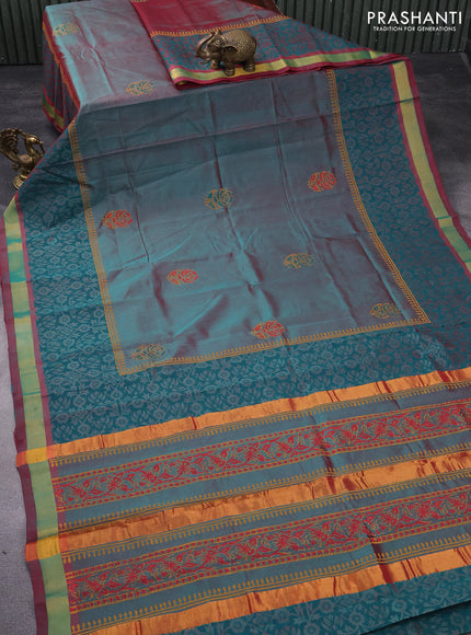 Silk cotton block printed saree dual shade of teal green and maroon shade with floral butta prints and zari woven border