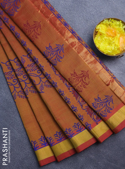 Silk cotton block printed saree dual shade of dark mustard with allover prints and zari woven border