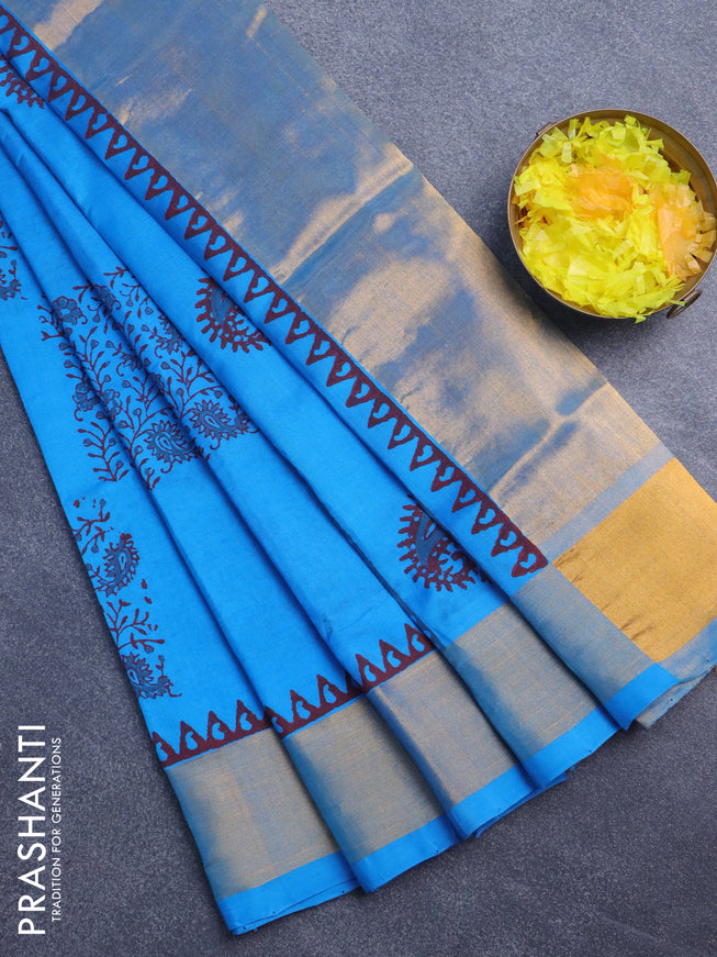 Silk cotton block printed saree cs blue with allover prints and zari woven border