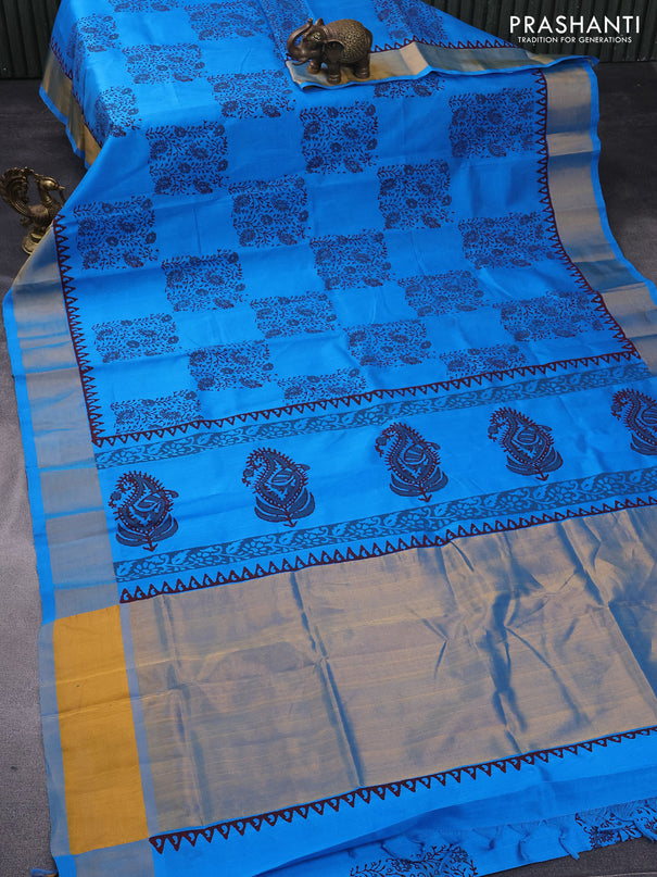 Silk cotton block printed saree cs blue with allover prints and zari woven border