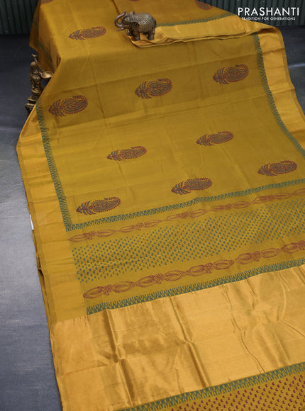 Silk cotton block printed saree dark mustard with paisley butta prints and zari woven border