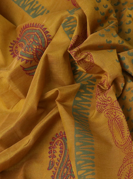 Silk cotton block printed saree dark mustard with paisley butta prints and zari woven border