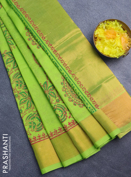 Silk cotton block printed saree light green with allover prints and zari woven border