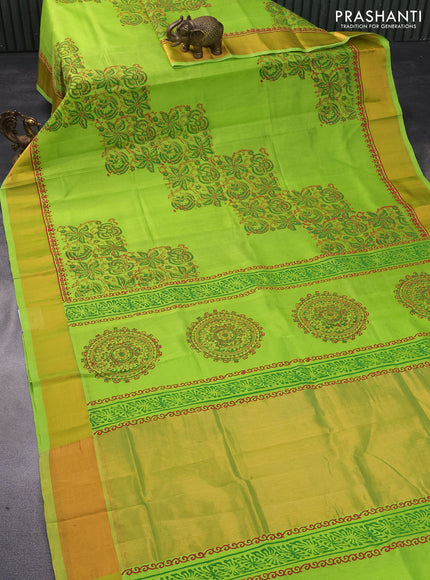 Silk cotton block printed saree light green with allover prints and zari woven border