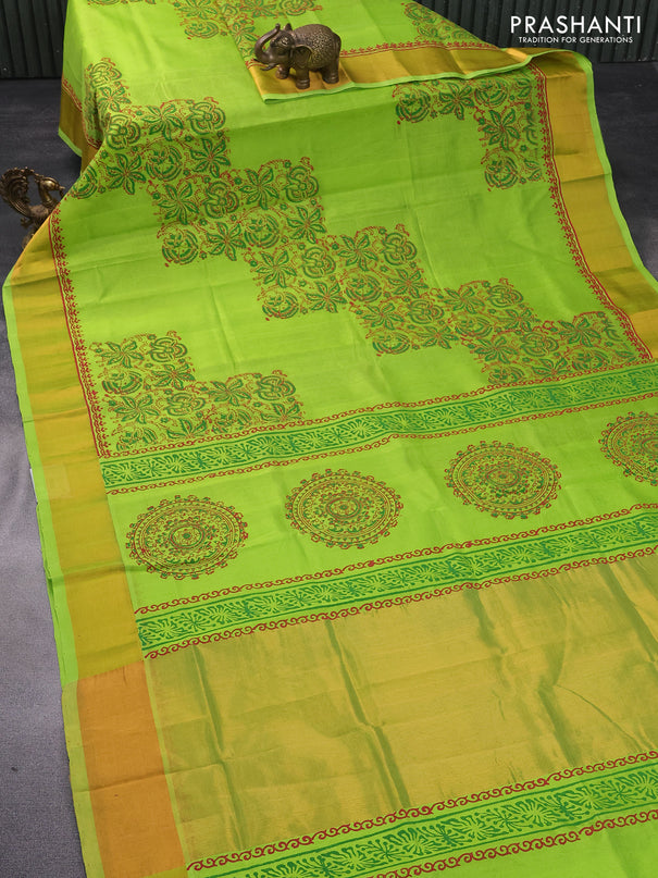 Silk cotton block printed saree light green with allover prints and zari woven border