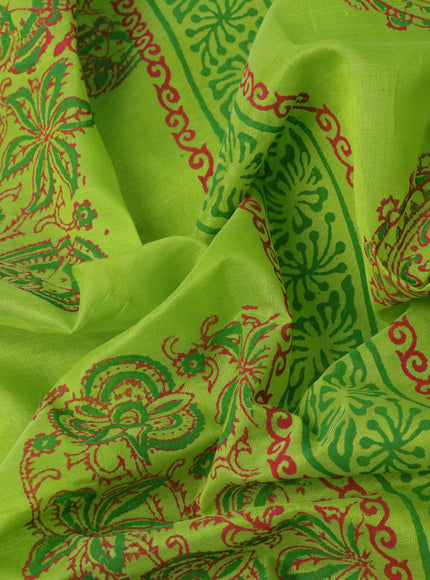 Silk cotton block printed saree light green with allover prints and zari woven border