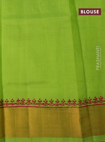 Silk cotton block printed saree light green with allover prints and zari woven border