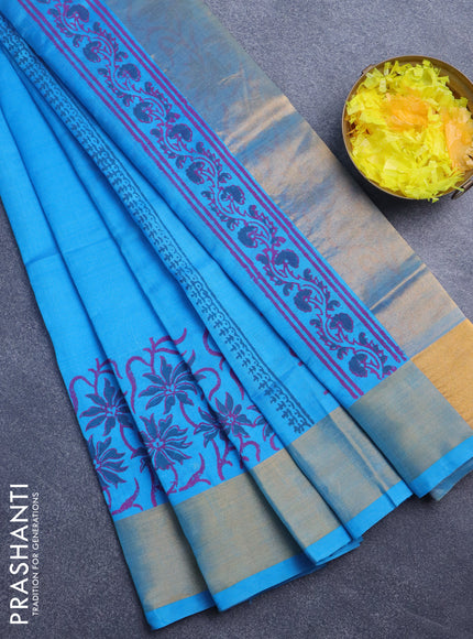 Silk cotton block printed saree cs blue with floral butta prints and zari woven border