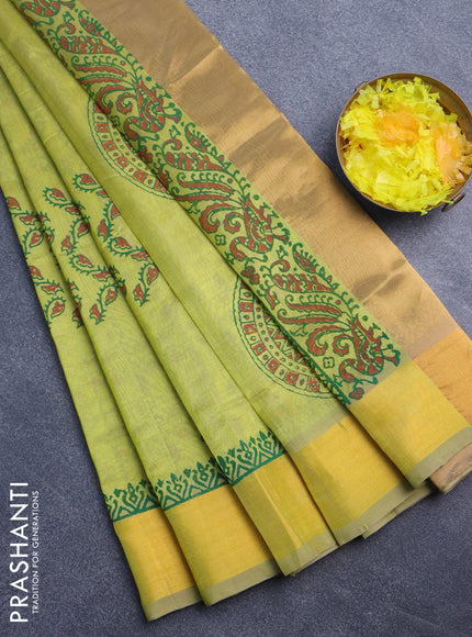 Silk cotton block printed saree lime green shade with allover prints and zari woven border