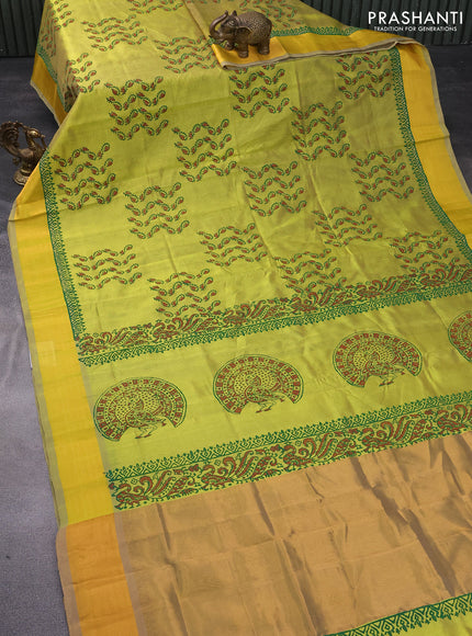 Silk cotton block printed saree lime green shade with allover prints and zari woven border