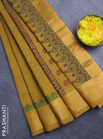 Silk cotton block printed saree dark mustard with paisley butta prints and zari woven border