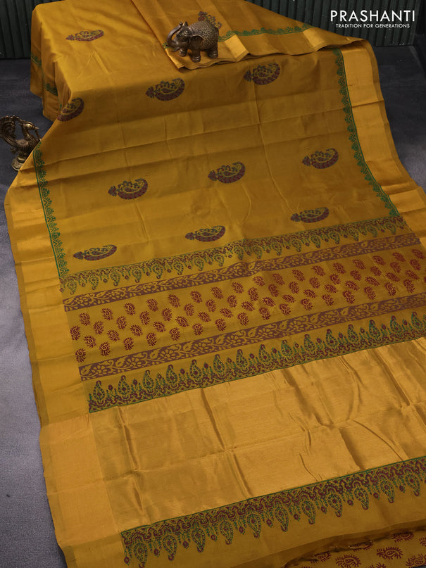 Silk cotton block printed saree dark mustard with paisley butta prints and zari woven border