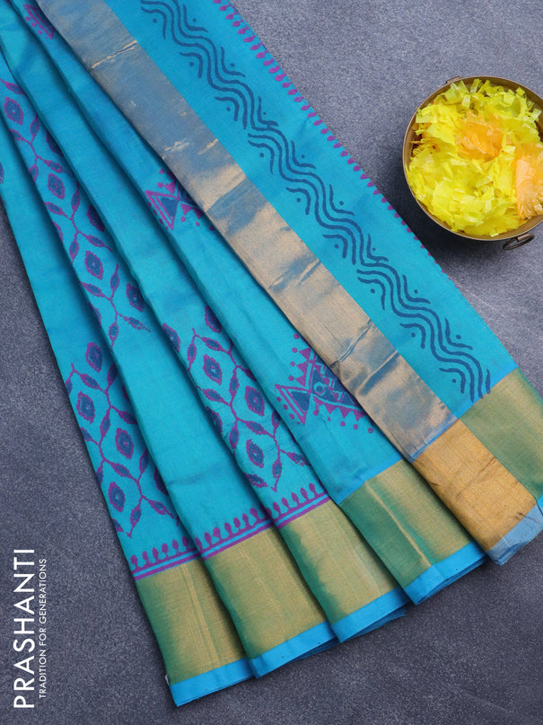 Silk cotton block printed saree dual shade of teal blue with allover prints and zari woven border