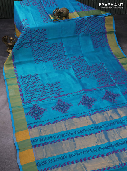 Silk cotton block printed saree dual shade of teal blue with allover prints and zari woven border