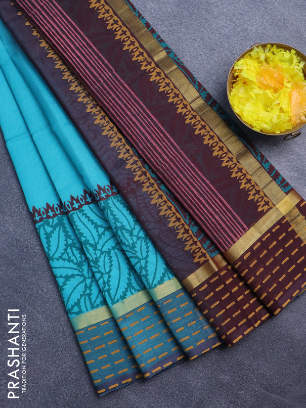 Silk cotton block printed saree teal blue and coffee brown with prints and zari woven printed border