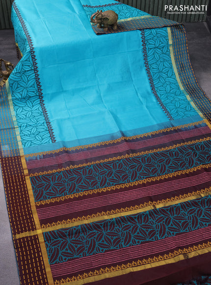 Silk cotton block printed saree teal blue and coffee brown with prints and zari woven printed border