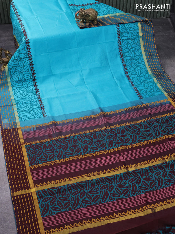 Silk cotton block printed saree teal blue and coffee brown with prints and zari woven printed border