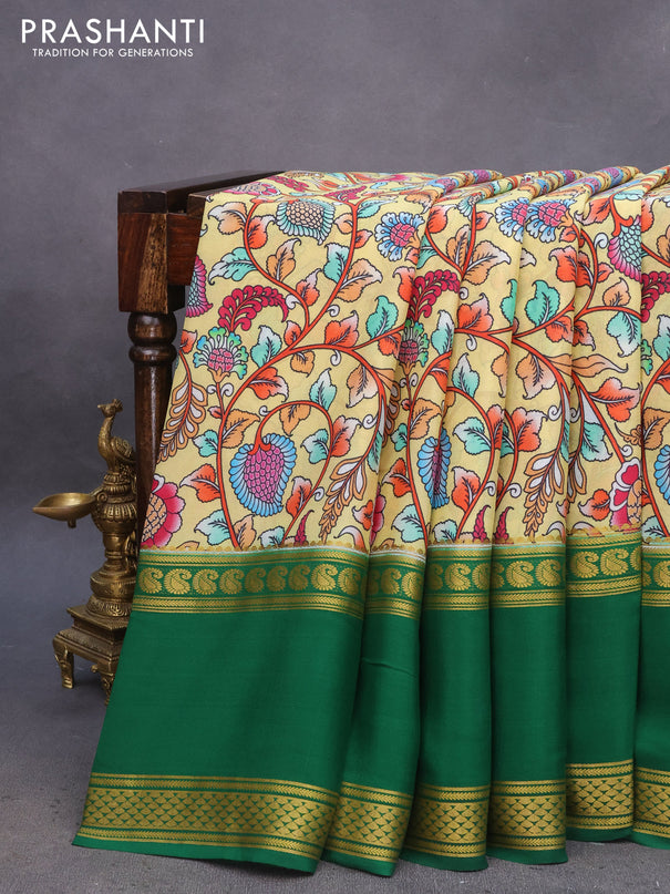 Pure mysore silk saree pale yellow and green with allover kalamkari digital prints and long rettapet zari woven border