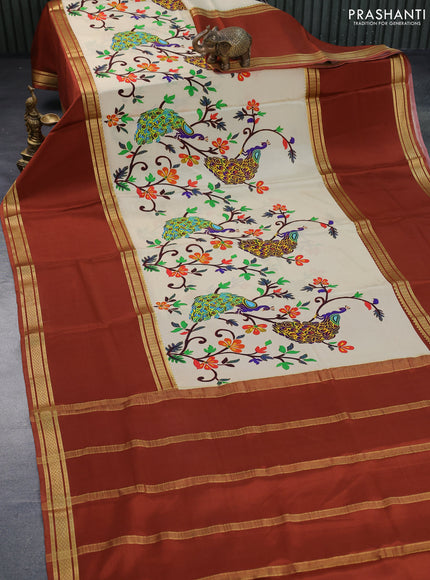 Pure mysore silk saree cream and rust shade with allover kalamkari digital prints and long rettapet zari woven border