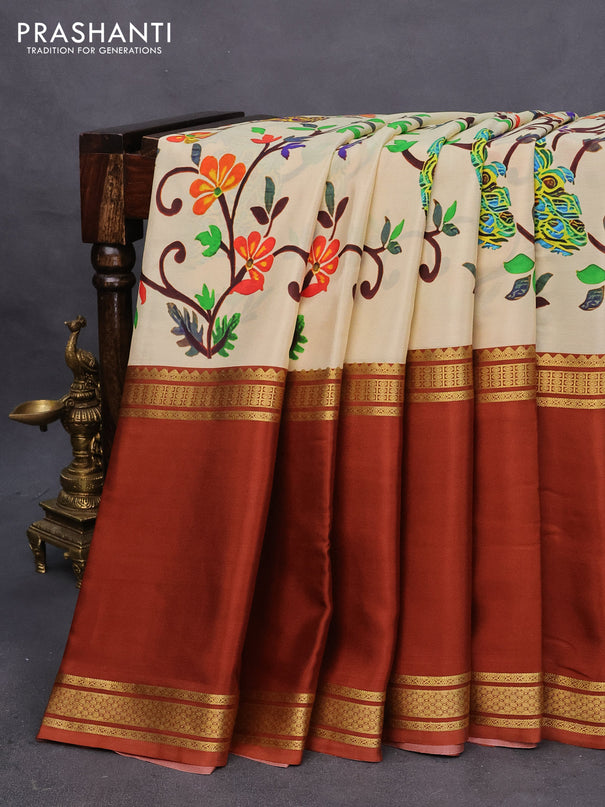 Pure mysore silk saree sandal and rust shade with allover kalamkari digital prints and long rettapet zari woven border