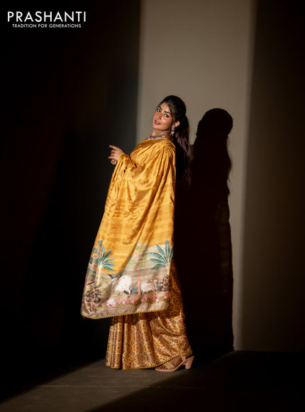 Semi tussar partly saree mustard shade with thread woven buttas & ajrakh prints and lace work border & pichwai printed pallu