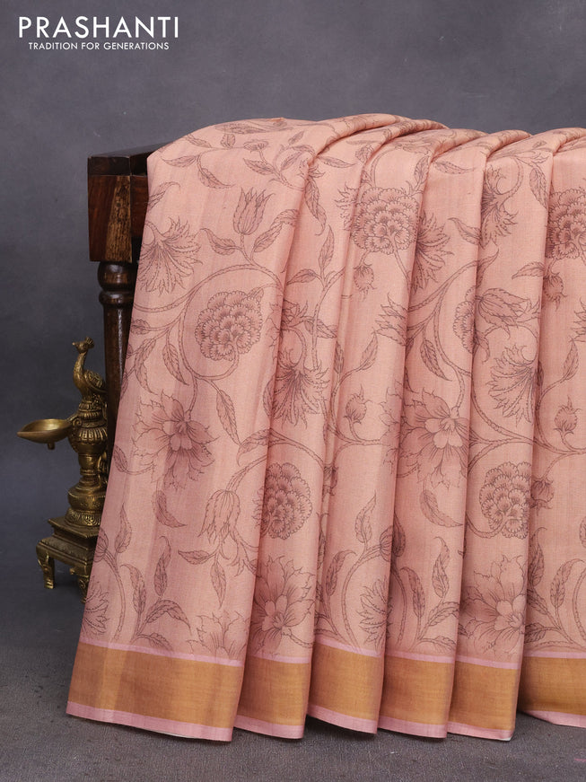 Tissue silk saree pastel peach shade with allover kalamkari prints and zari woven border