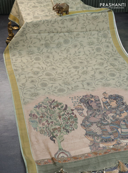 Tissue silk saree pastel green with allover kalamkari prints and zari woven border