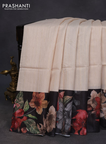 Semi tussar saree cream and black with plain body and floral digital printed border