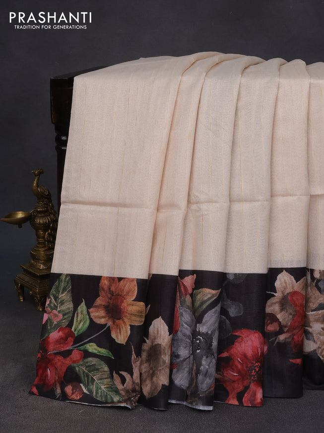 Semi tussar saree cream and black with plain body and floral digital printed border