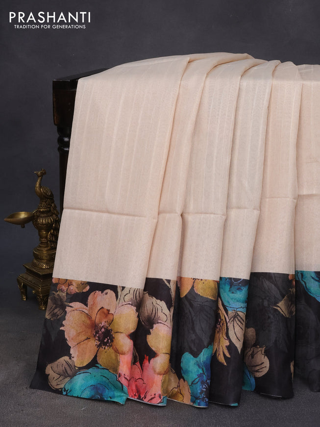 Semi tussar saree cream and black with plain body and floral digital printed border