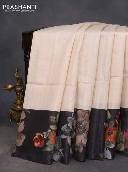 Semi tussar saree cream and black with plain body and floral digital printed border