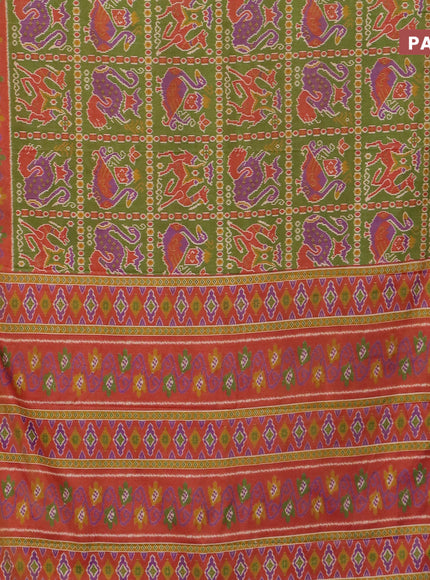 Semi tussar saree green and rust shade with allover ikat prints and zari woven border