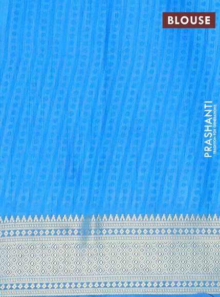 Semi tussar saree blue and cs blue with allover ikat prints and zari woven border