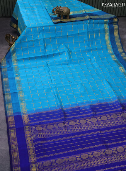 Silk cotton saree teal blue and blue with allover zari checked pattern and rettapet zari woven border