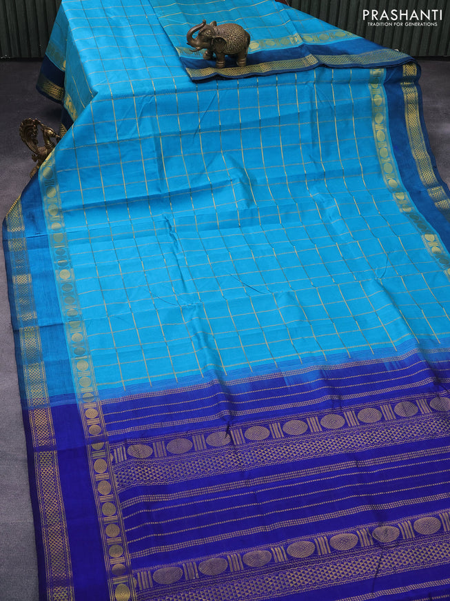 Silk cotton saree teal blue and blue with allover zari checked pattern and rettapet zari woven border