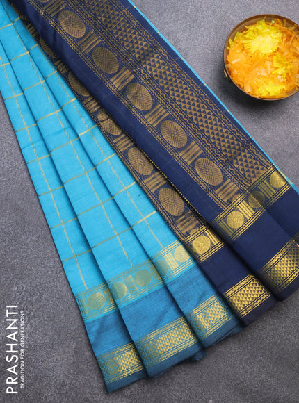 Silk cotton saree teal blue and peacock blue with allover zari checked pattern and rettapet zari woven border