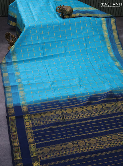 Silk cotton saree teal blue and peacock blue with allover zari checked pattern and rettapet zari woven border