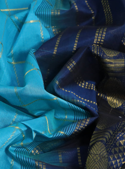 Silk cotton saree teal blue and peacock blue with allover zari checked pattern and rettapet zari woven border